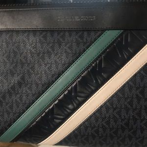 New Michael Kors clutch. It’s navy white & green with MK all over it.
